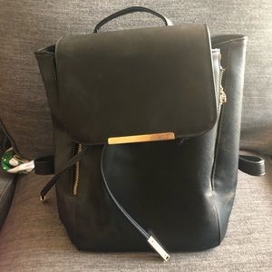 SOLD. Black backpack purse